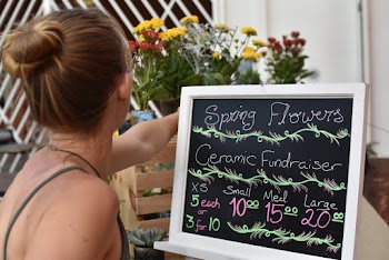 Woman Standing Beside Signage