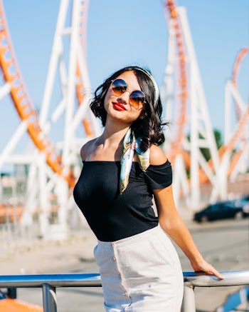 Woman Standing Beside Silver Railing