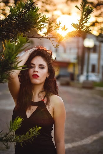Woman Standing Beside Tree