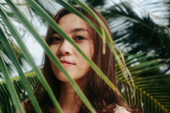 Woman Standing Beside Tree