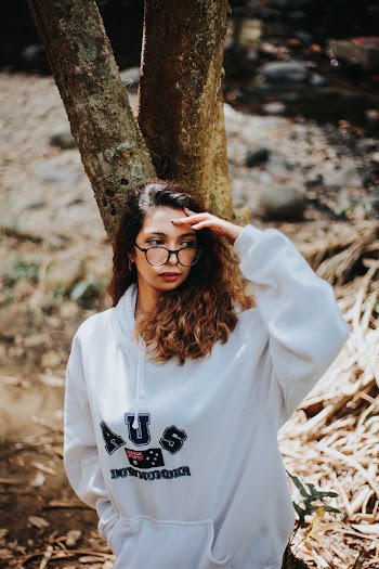 Woman Standing Beside Tree