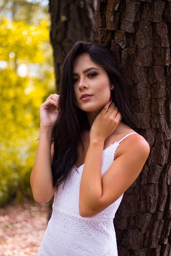 Woman Standing Beside Tree