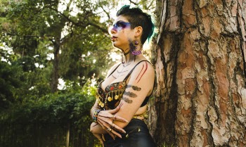 Woman Standing Beside Tree Trunk