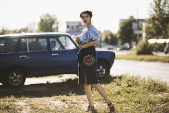 Woman Standing Beside Vehicle