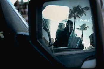Woman Standing Beside Vehicle