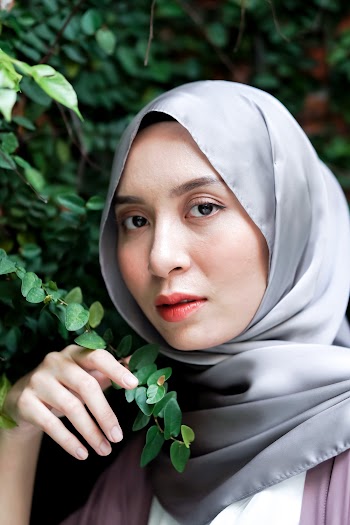 Woman Standing Beside Vine Plant