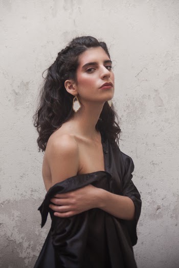 Woman Standing Beside Wall