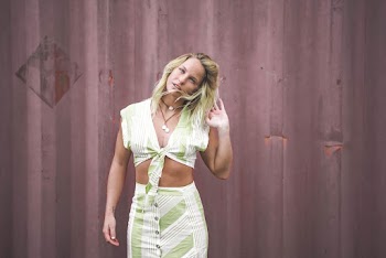 Woman Standing Beside Wall Wearing Crop Top