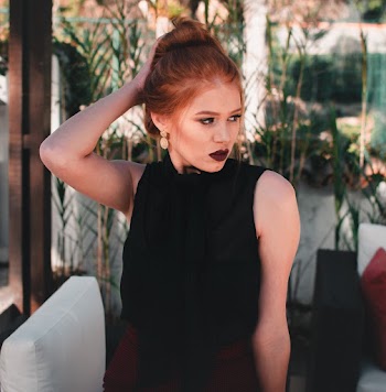 Woman Standing Beside White Sofa