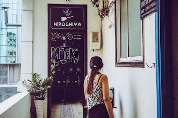Woman Standing Beside Window