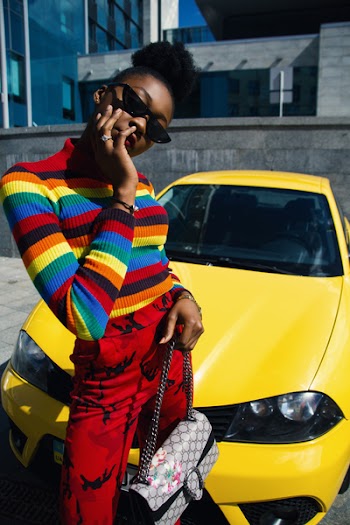 Woman Standing Beside Yellow Car