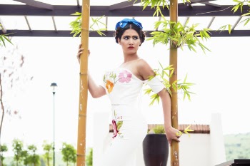 Woman Standing Between Bamboos