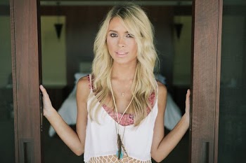 woman standing between brown wooden doors
