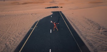 Woman Standing Between Road