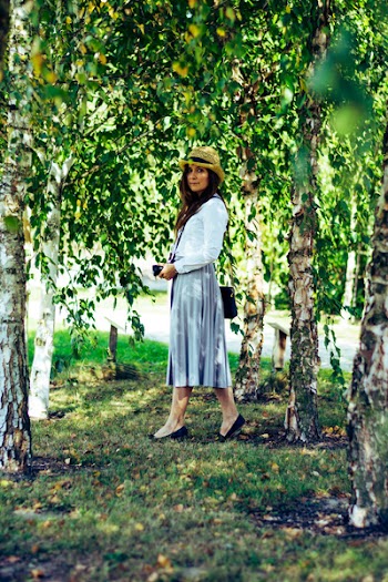 Woman Standing Between Trees