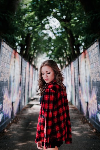 Woman Standing Between Walls