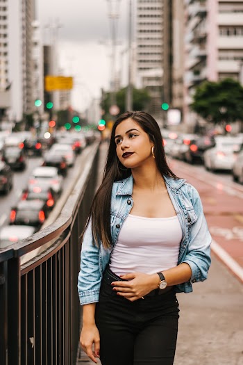 Woman Standing Black Fence