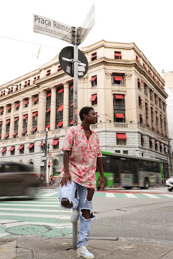 Woman Standing by the Corner of Street