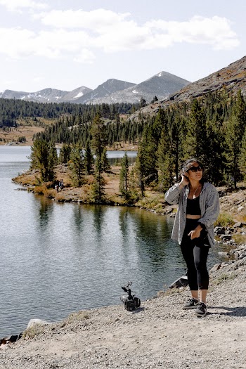 Woman Standing By The Lake