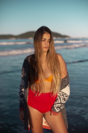 Woman Standing by the Sea