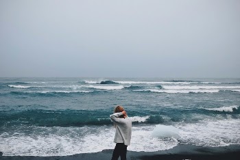 Woman standing by the sea, | Free Photo - rawpixel