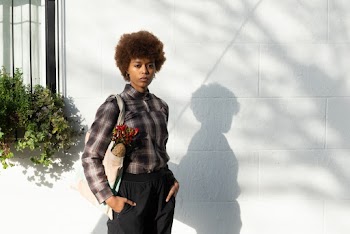 Woman Standing by the Wall