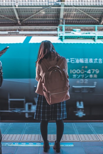 Woman Standing Carrying Backpack