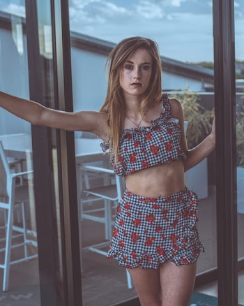 Woman Standing Front of Glass Door