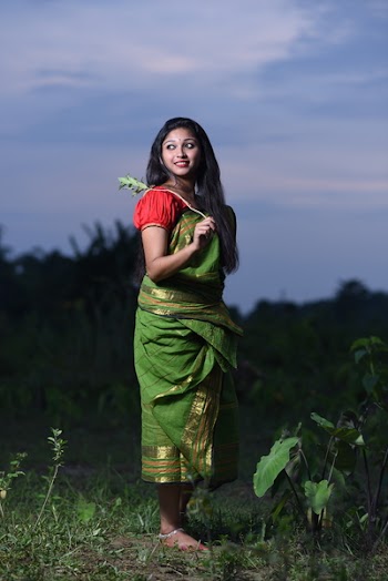 Woman Standing Holding Plant