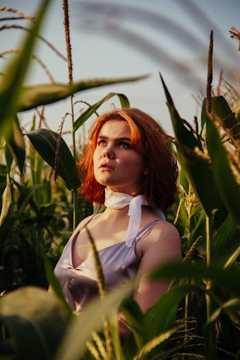 Woman Standing In A Field