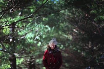 Woman Standing in Forest