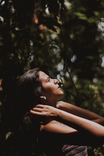 Woman Standing in Forest