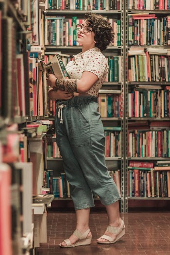 Woman Standing in Front of Books