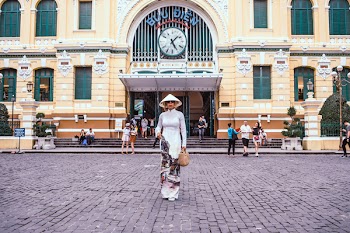 Woman Standing In Front Of Building