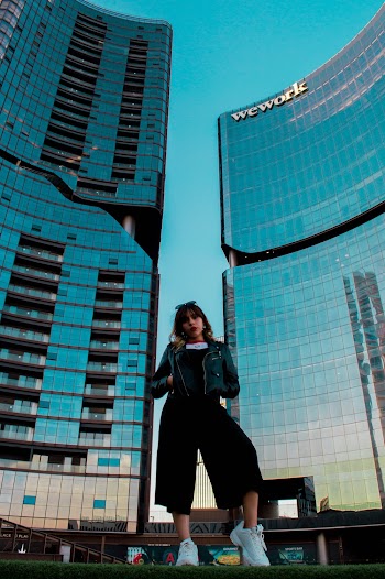 Woman Standing in Front of Buildings