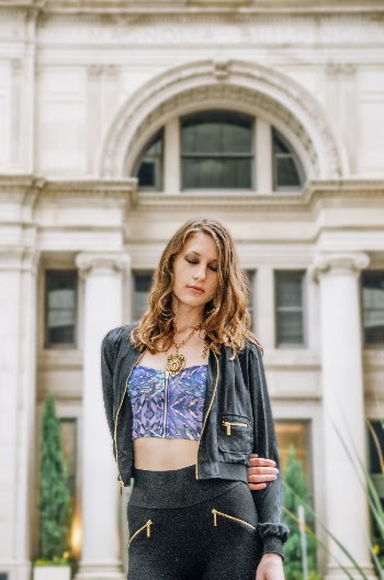 Woman Standing in Front of Concrete Building