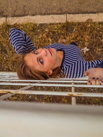 Woman Standing in Front of Fence