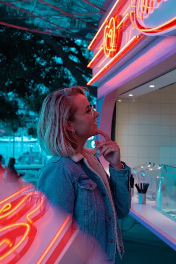 Woman Standing in Front of Food Stall