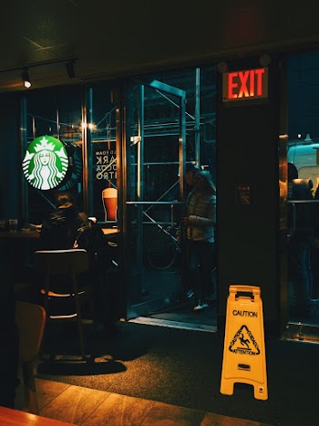 Woman Standing in Front of Opened Door