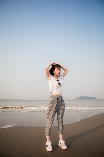 Woman Standing in Front of Shoreline