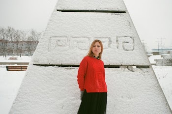 Woman Standing in Front of Statue