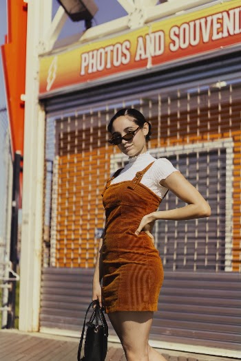 Woman Standing In Front Of Store