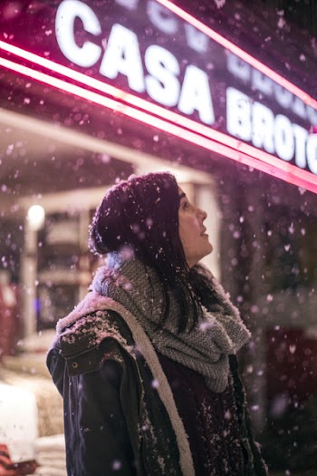 Woman Standing in Front of Store