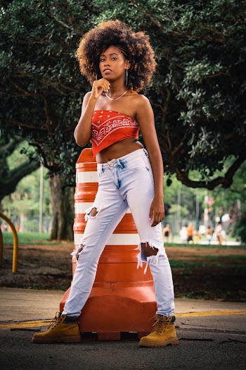 Woman Standing in Front of Street Cone