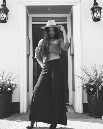 Woman Standing in Front of the Door Grayscale Photo