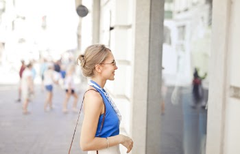 Woman Standing in Front of the Store