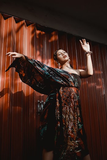 Woman Standing in Front of Wall