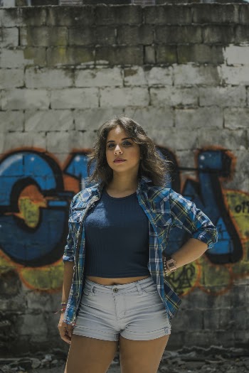 Woman Standing in Front of Wall