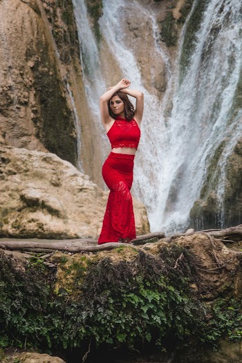 Woman Standing in Front of Waterfalls