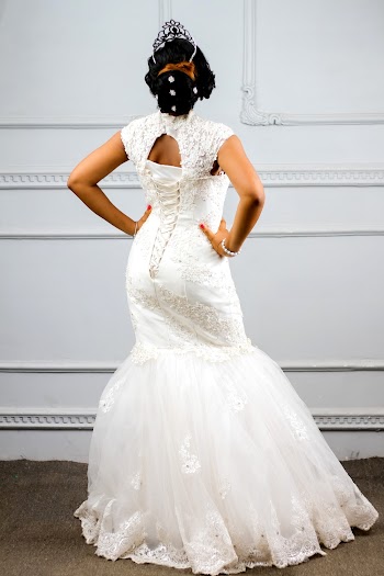 Woman Standing in Front of White Wall